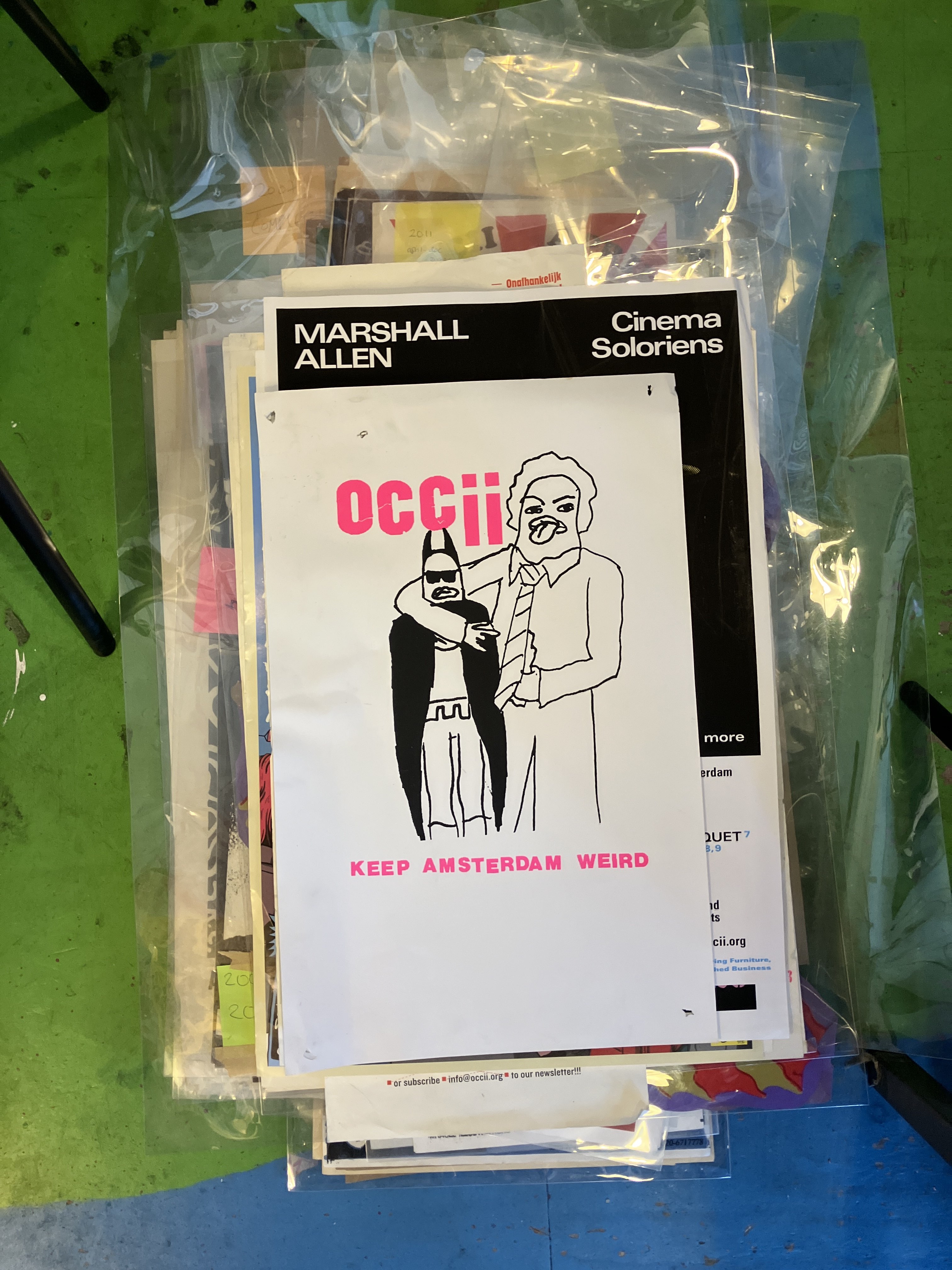 A screen-printed OCCII flyer saying "Keep Amsterdam Weird"